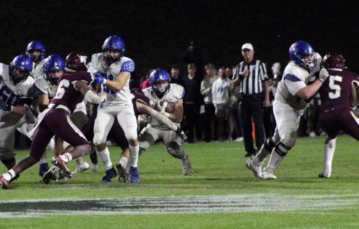 Laython Biddle attempts to break the tackle